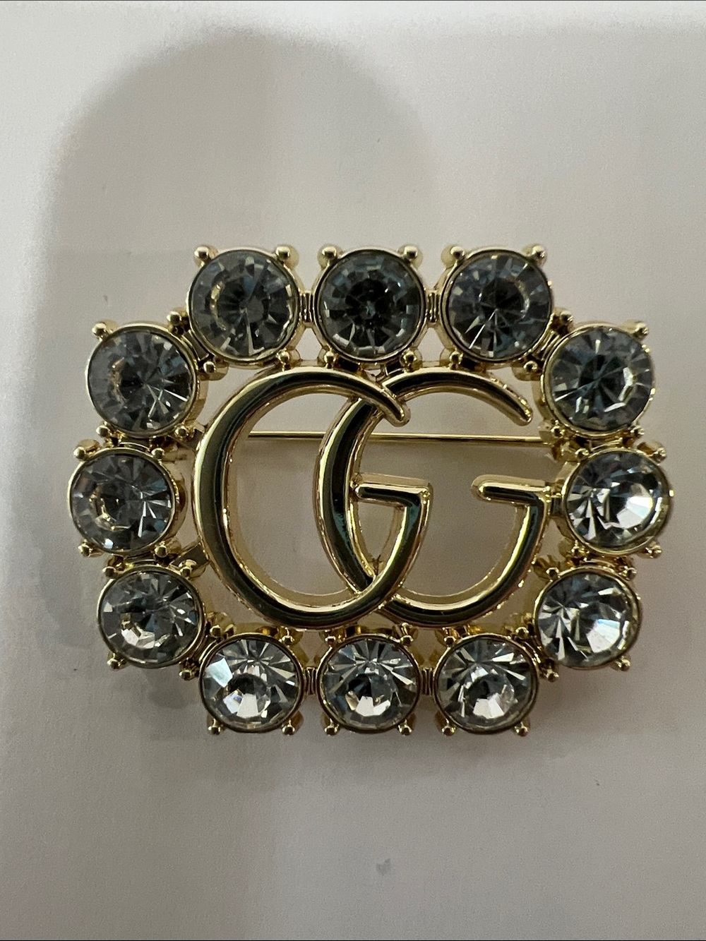 Gucci Gold GG Crystal Circle Brooch with Clear Stones
